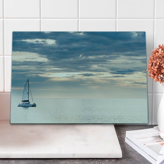 Nautical Cutting Board, Sailing Yacht in the Morning Time on Tranquil Seascape Cloudy Sky Peaceful Marine Image, Decorative Tempered Glass Cutting and Serving Board, Large Size, Blue, by Ambesonne