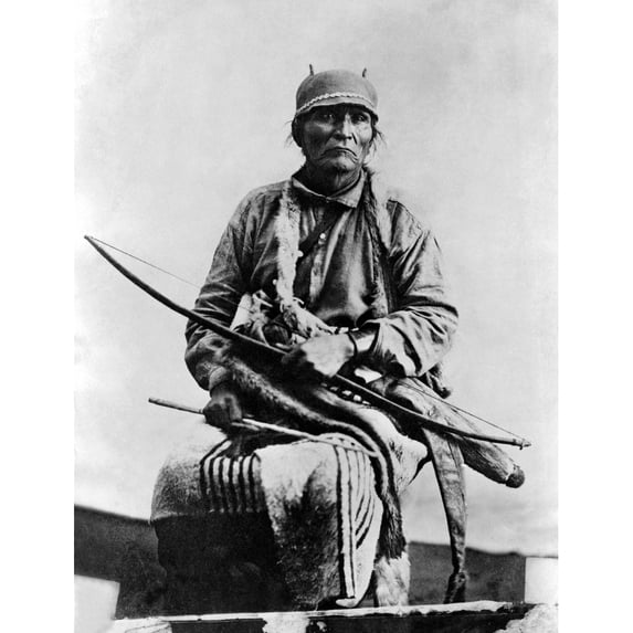 Navajo Man C1914. Na Navajo Man Identified As Harririo Holding A Bow Arrow And Quiver. Photograph By John Gaw Meem