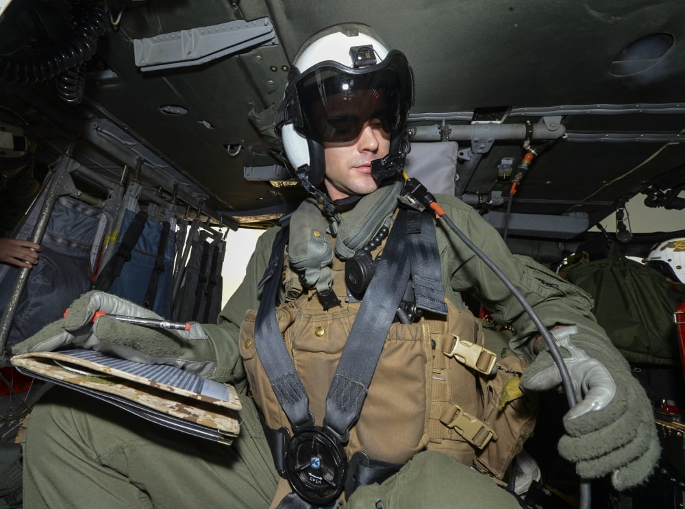 Naval Air Crewmen conducts preflight checks on a MH-60S Sea Hawk Canvas Art - Stocktrek Images (33 x 24)