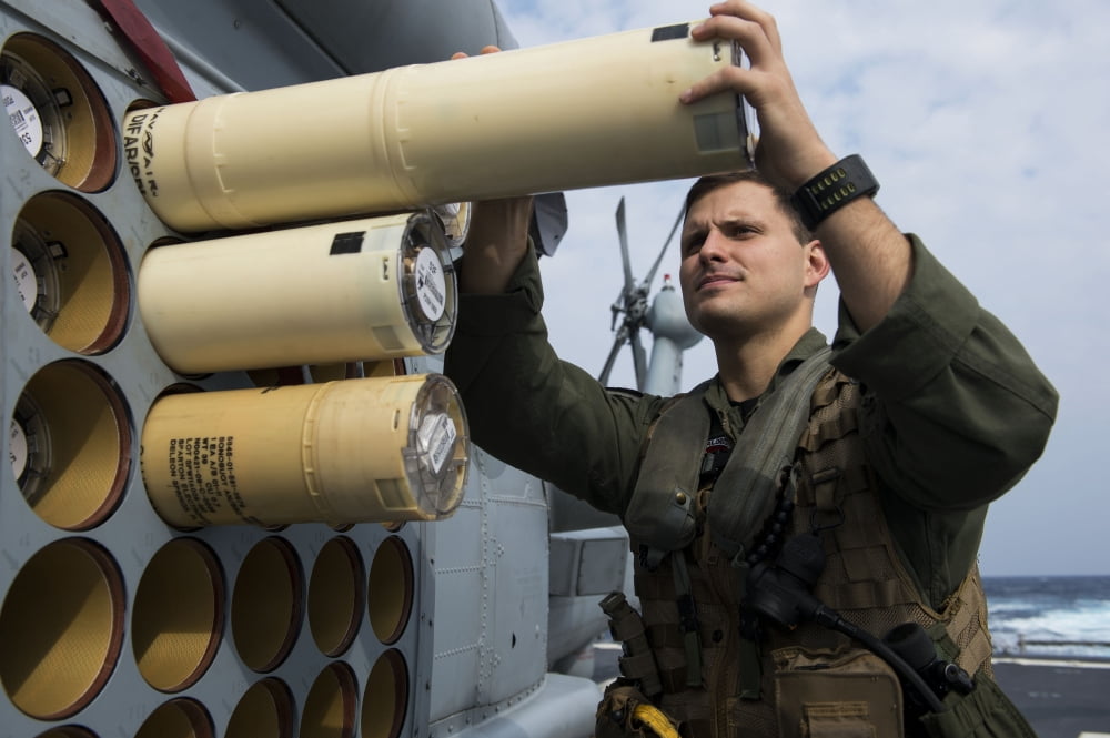 Naval Aircrewman loads sonobuoys on an MH-60R Seahawk Canvas Art - Stocktrek Images (34 x 23)