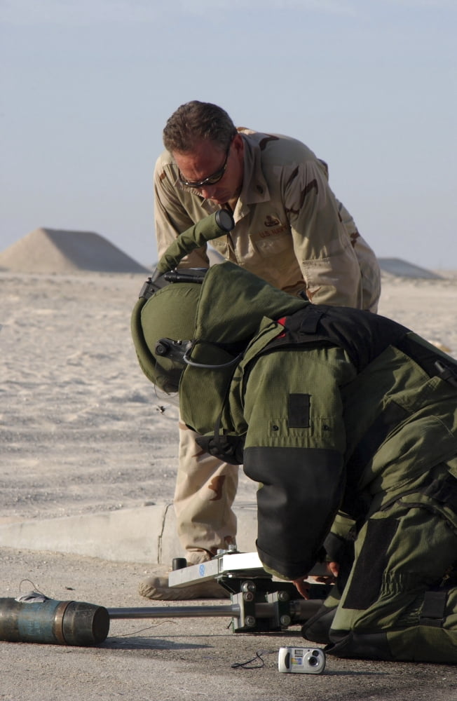 Navy Explosive Ordnance Disposal Mobile Unit members rendering safe an Improvised Explosive Device Canvas Art - Stocktrek Images (23 x 34)