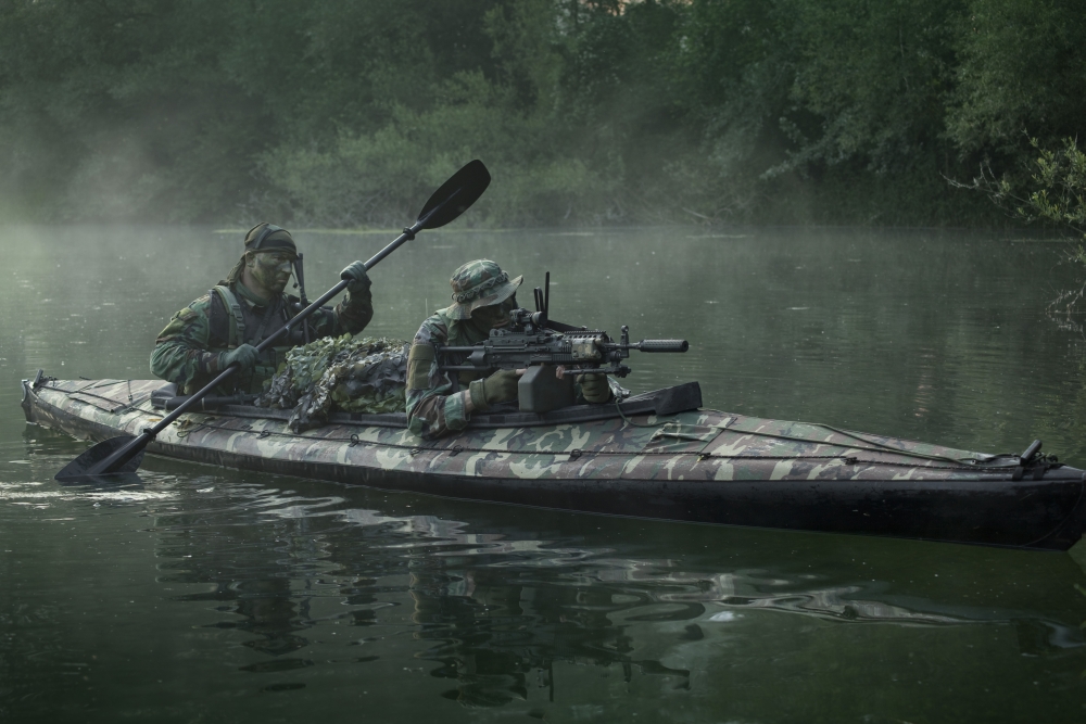 Navy SEALs navigate the waters in a folding kayak during jungle warfare operations Canvas Art - Tom WeberStocktrek Images (35 x 24)