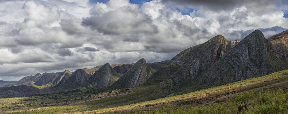 Near vertical sandstone beds form a sinuous hogs back of prominent multicolored ridges in Toro Toro National Park Bolivia Canvas Art - Robert Postma Design Pics (44 x 18)