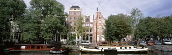 Netherlands Amsterdam Boats in canal Canvas Art - Panoramic Images (36 x 12)