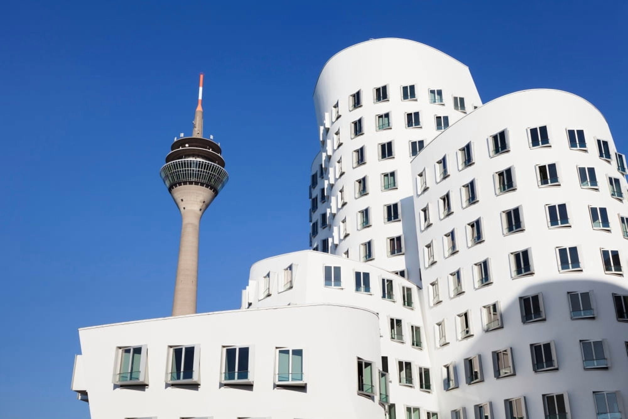 Neuer Zollhof buildings designed by Frank Gehry with Rheinturm Tower Media Harbour Dusseldorf North Rhine Westphalia Germany Canvas Art - Panoramic Images (27 x 9)