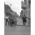 thumbnail image 1 of New Orleans C1925. Nan Organ Grinder On The Street In New Orleans Louisiana. Photograph By Arnold Genthe C1925. Print, 1 of 3