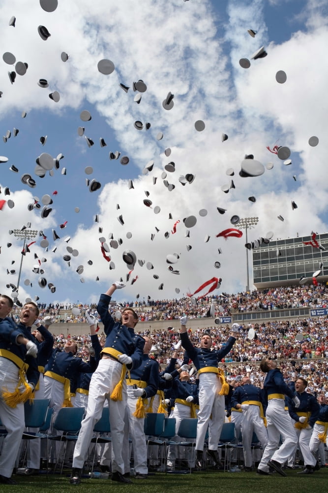 Newly commissioned US Naval Officers celebrate by throwing their hats in the air Canvas Art - Stocktrek Images (23 x 34)