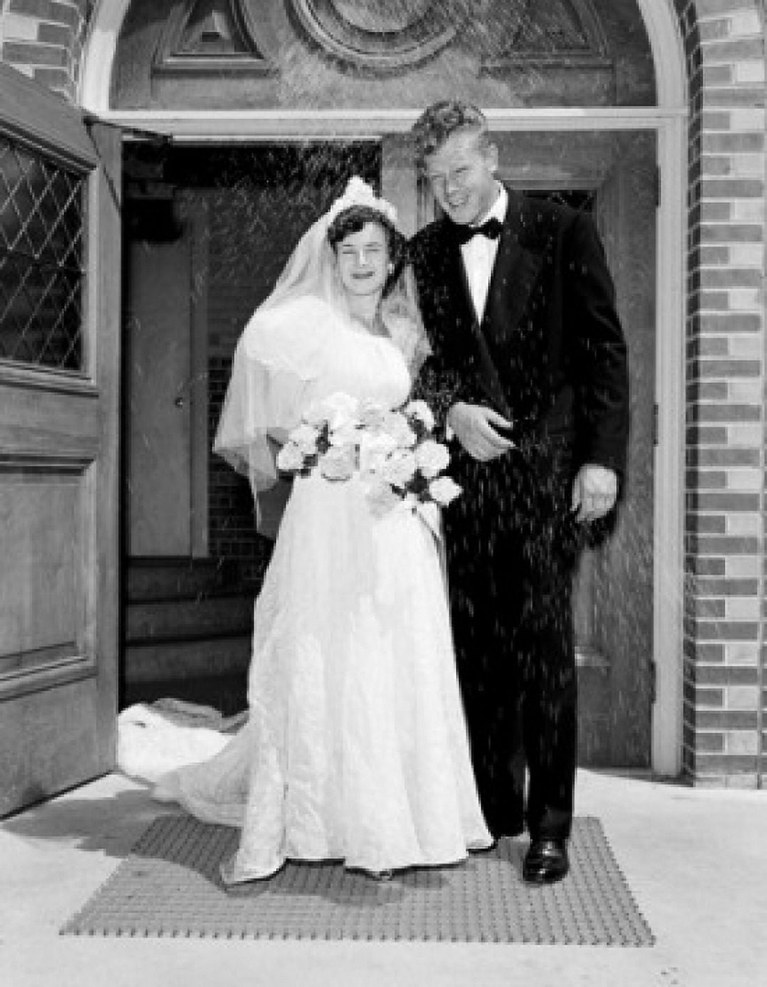 Newly wed couple in front of church Canvas Art - (24 x 36)