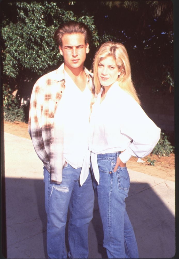 Nick Savalas In Jeans And Flannel With Tori Spelling In Jeans And White
