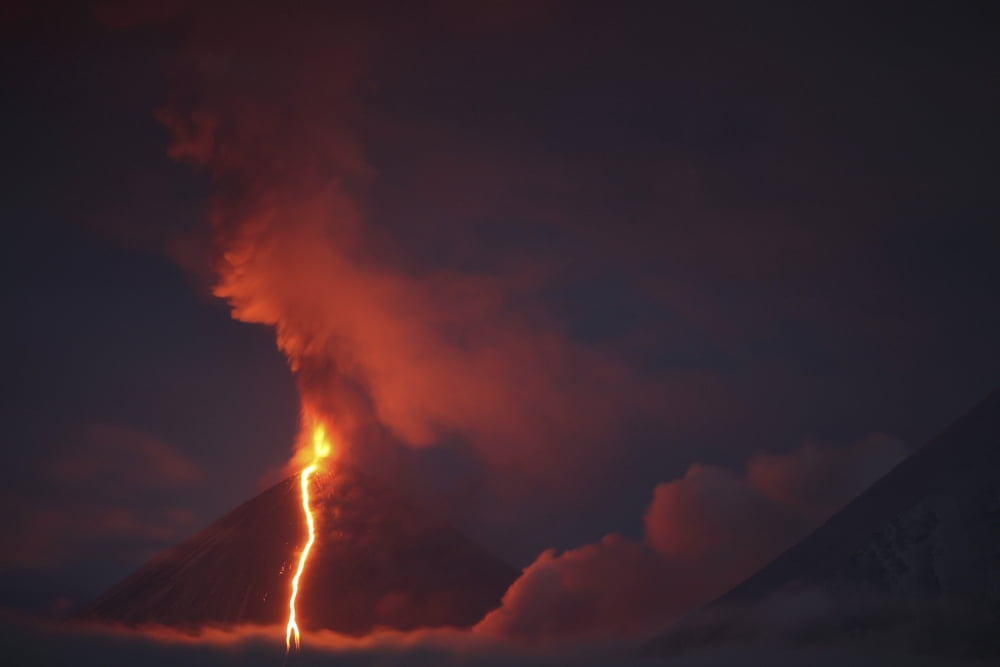 Nighttime eruption of Kliuchevskoi Volcano Russia Canvas Art - Richard RoscoeStocktrek Images (35 x 23)