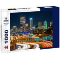 Noah Jigsaw Puzzle Pittsburgh skyline by night. The rush hour traffic leaves light trails on I