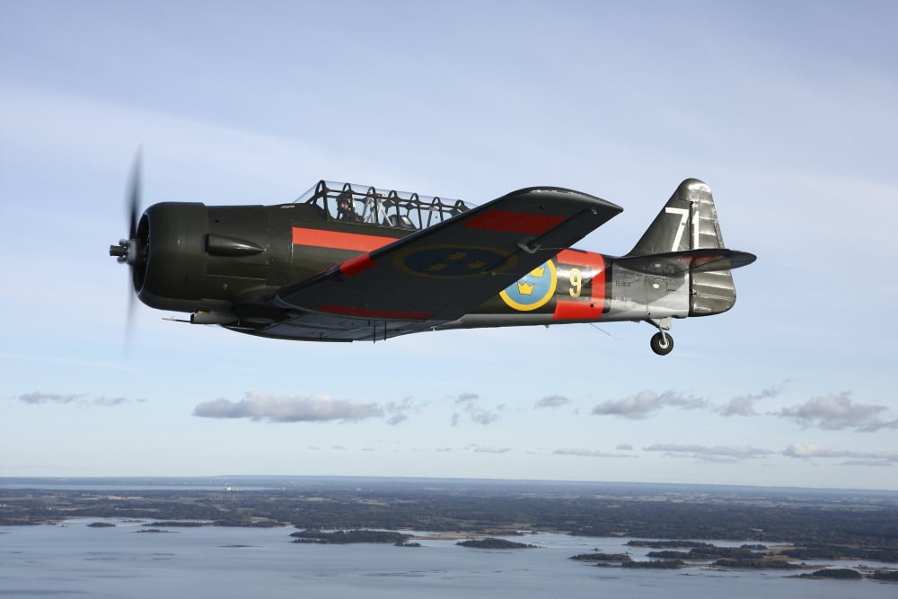 North American Aviation T-6 Texan trainer warbird in Swedish Air Force colors Canvas Art - Daniel KarlssonStocktrek Images (18 x 12)