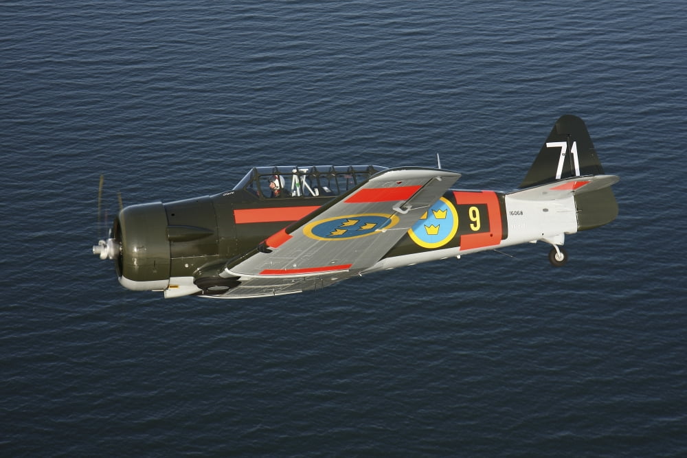 North American Aviation T-6 Texan trainer warbird in Swedish Air Force colors Canvas Art - Daniel KarlssonStocktrek Images (35 x 24)