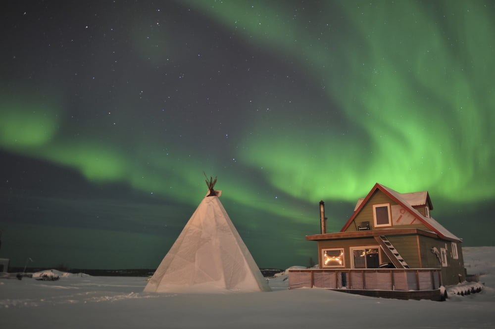 Northern Lights above village Northwest Territories Canada Canvas Art - Jiri HermannStocktrek Images (18 x 12)
