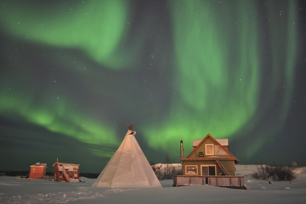 Northern Lights above village Northwest Territories Canada Canvas Art - Jiri HermannStocktrek Images (35 x 23)