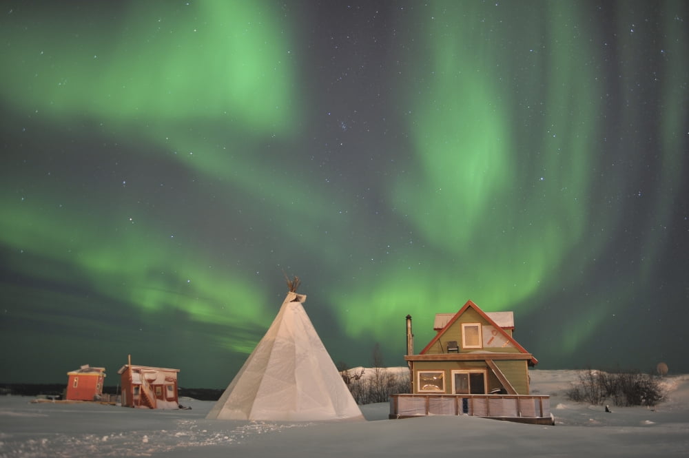 Northern Lights above village Northwest Territories Canada Canvas Art - Jiri HermannStocktrek Images (35 x 23)