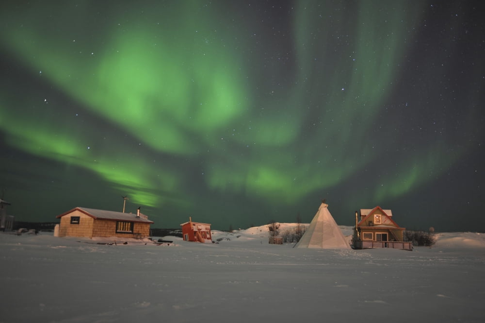Northern Lights above village Northwest Territories Canada Canvas Art - Jiri HermannStocktrek Images (35 x 23)