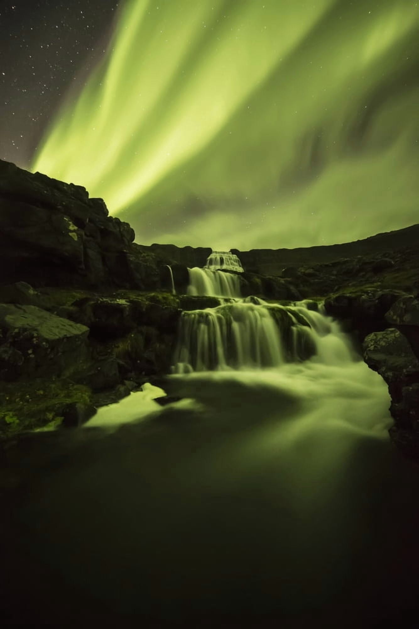 Northern Lights or Aurora Borealis glowing over waterfalls and a stream Iceland Canvas Art - Robert Postma Design Pics (12 x 19)