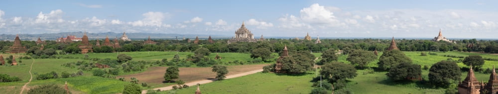 Northern and eastern view of stupas and temples from top of Shwe San Taw temple Thatbyinnyu temple in center Bagan Mandalay Region Myanmar Canvas Art - Panoramic Images (64 x 12)