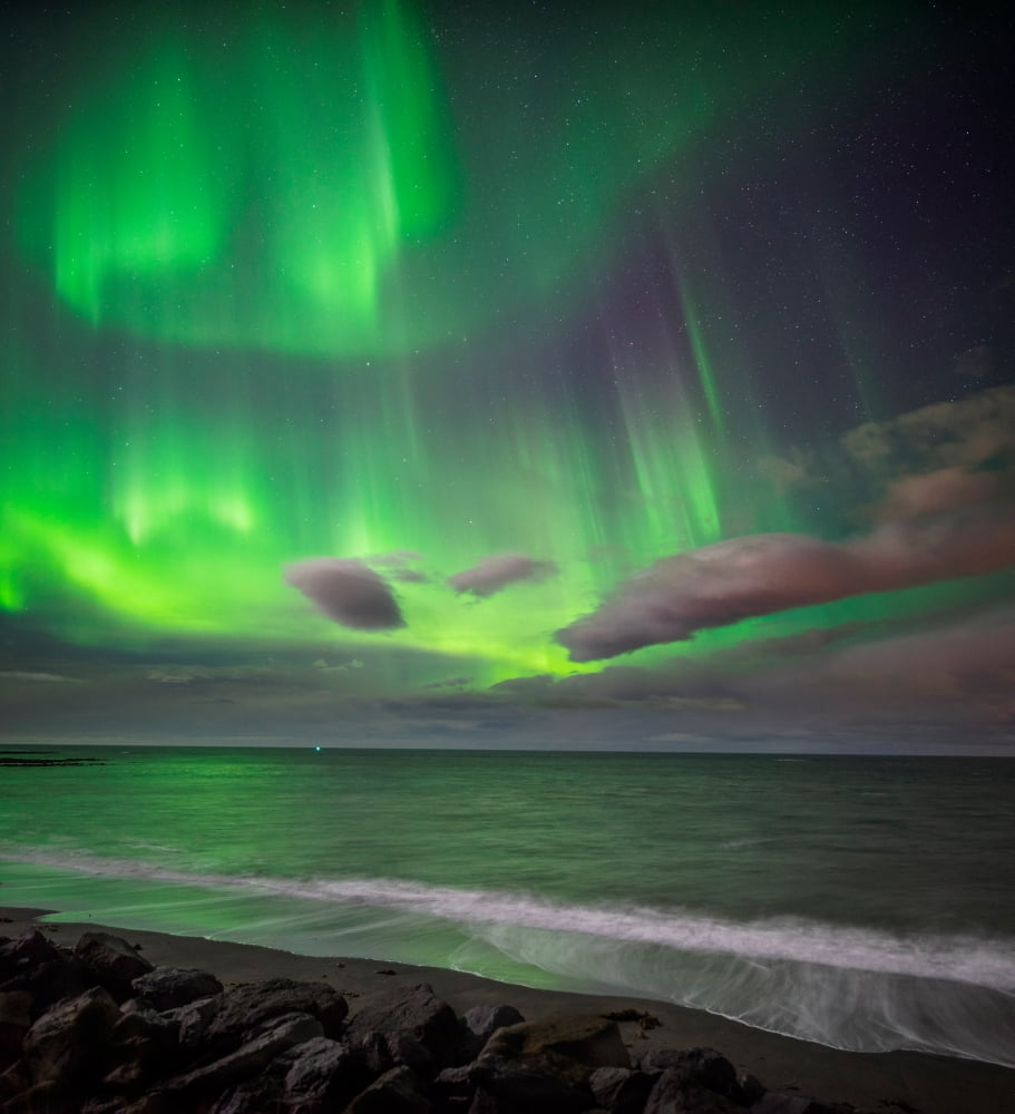 Northern lights over the waves breakiing on the beach in Seltjarnarnes Reykjavik Iceland Canvas Art - Panoramic Images (24 x 24)