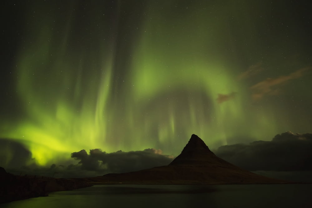 Northern lights over top of Kirkjufell the most photographed mountain in Iceland Iceland Canvas Art - Robert Postma Design Pics (38 x 24)