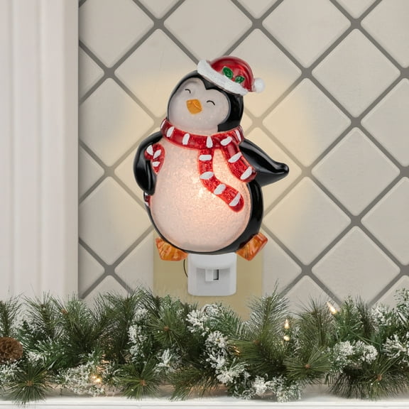 Northlight Happy Penguin Holding Candy Cane in Santa Hat Christmas Night Light - 6"