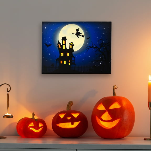Northlight LED Lighted Fiber Optic Witch Flying Over Haunted House Halloween Canvas Wall Art - 12" x