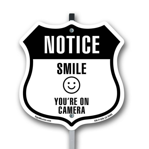Notice Smile You're on Camera 12 inch X 12 inch Shield Shaped Rust-Free Aluminum Metal Sign with Aluminum Mounting Stake Weather Resistant Made in the USA
