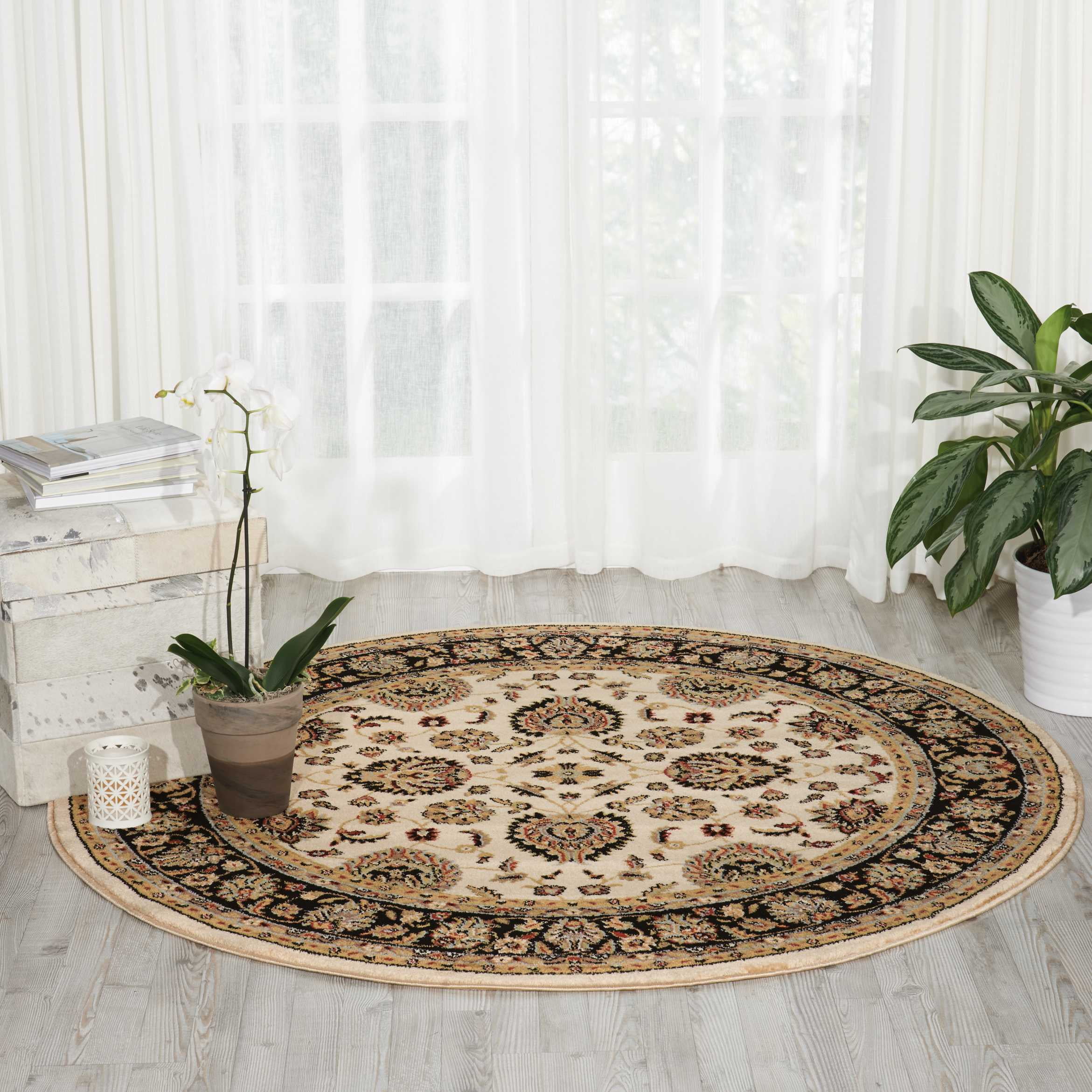 Round Black and Ivory Floral Synthetic Area Rug