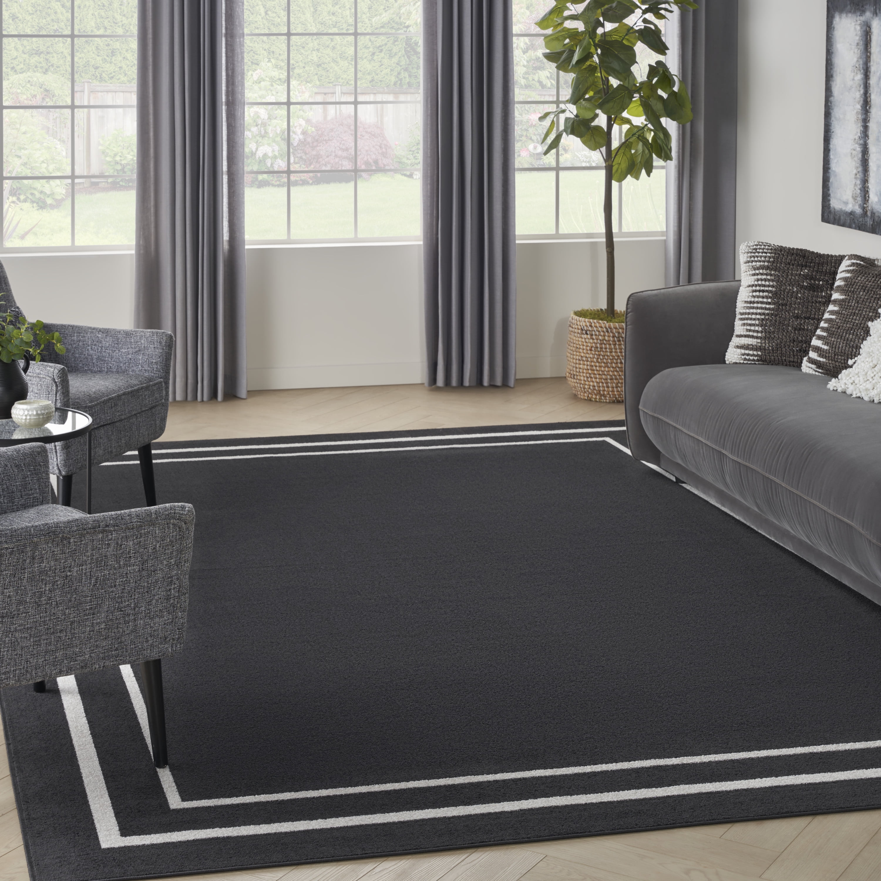 Reversible Black Ivory Synthetic 9' x 12' Area Rug