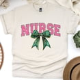thumbnail image 1 of Nurse Graphic T-Shirt | Pink Lettering with Green Bow Tee for Women, Natural, Size S, 1 of 6