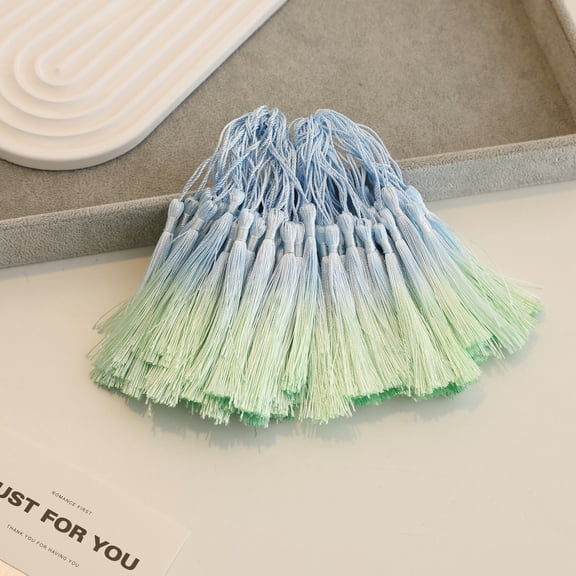 Nvzi 50 pieces of Blue-Green handmade tassels, 3 inches long, with looped craftsmanship. The tassels are soft and durable, suitable for DIY earrings, bookmarks, and holiday decorations
