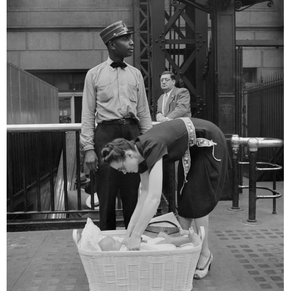 Nyc Penn Station 1942. Na Woman And Her Baby Waiting For Their Train At Penn Station In New York City. Photograph By