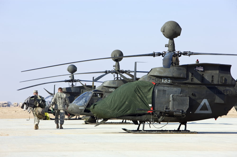 OH-58D Kiowa Warrior helicopters parked at Camp Speicher Iraq Canvas Art - Terry MooreStocktrek Images (35 x 23)