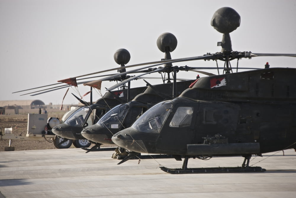 OH-58D Kiowa helicopters on the flight line at COB Speicher Iraq Canvas Art - Terry MooreStocktrek Images (18 x 12)