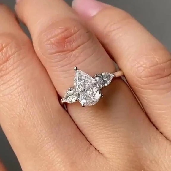 ORLOV DIAMONDS 2.70Ct Pear Cut Moissanite Three Stone Engagement Ring in 14K White Gold Plated