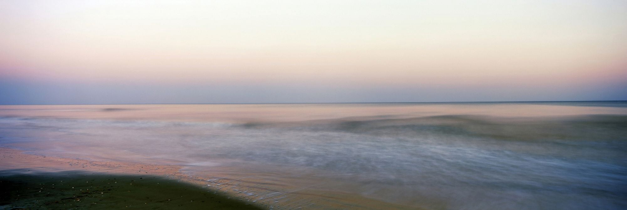 Ocean at sunset Folly Beach Folly Island Charleston County South Carolina USA Canvas Art - Panoramic Images (27 x 9)