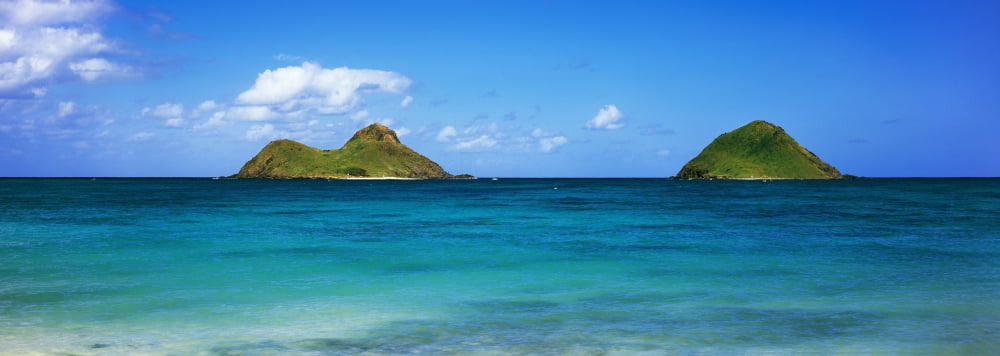 Ocean with mountains in the background Na Mokulua Lanikai Honolulu County Oahu Hawaii Islands Hawaii USA Canvas Art - Panoramic Images (13 x 36)