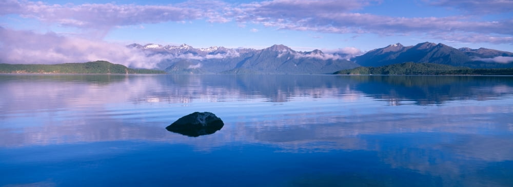 Ocean with mountains in the background at dawn South Island New Zealand Canvas Art - Panoramic Images (27 x 9)