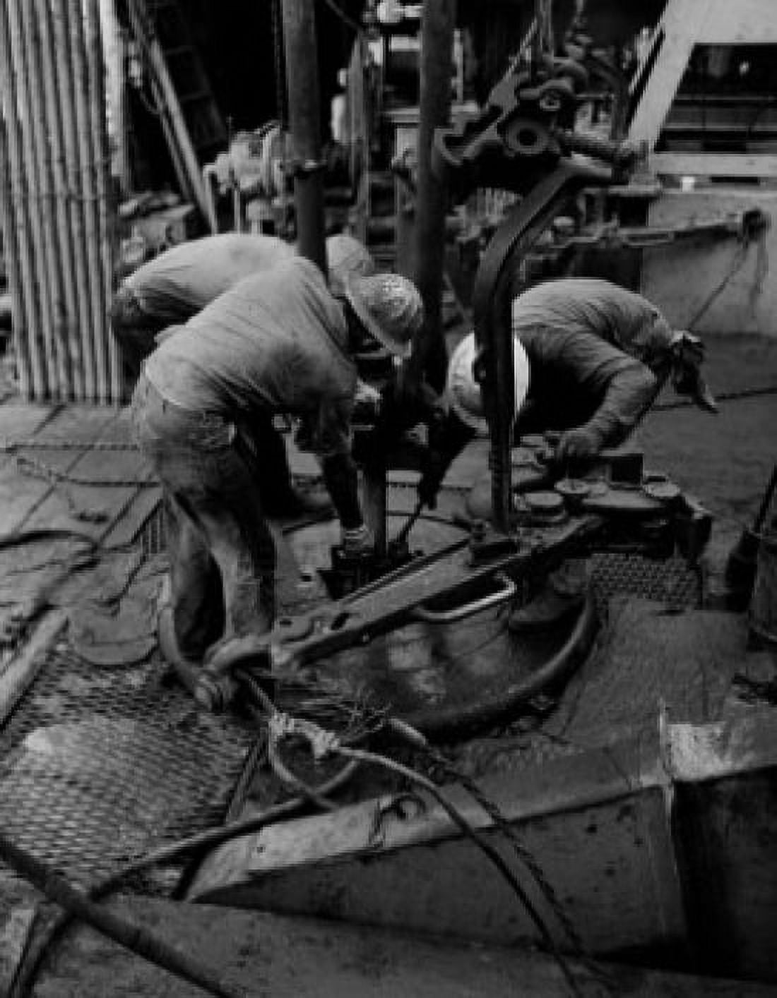 Offshore oil rig personnel in Gulf of Mexico during operation called yo-yoing Canvas Art -  (18 x 24)