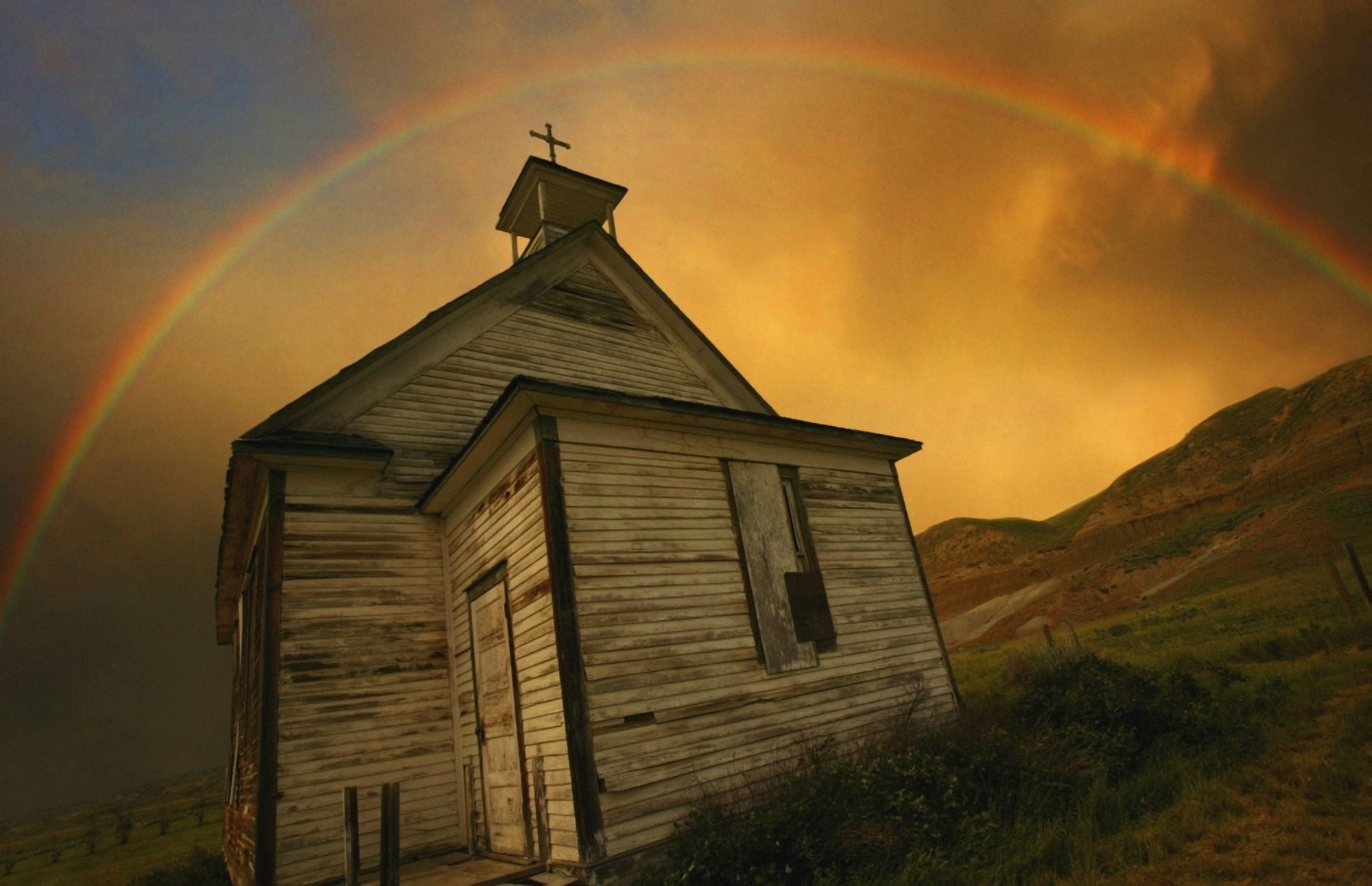 Old Church With Rainbow Over Building Canvas Art - Don Hammond Design Pics (34 x 22)