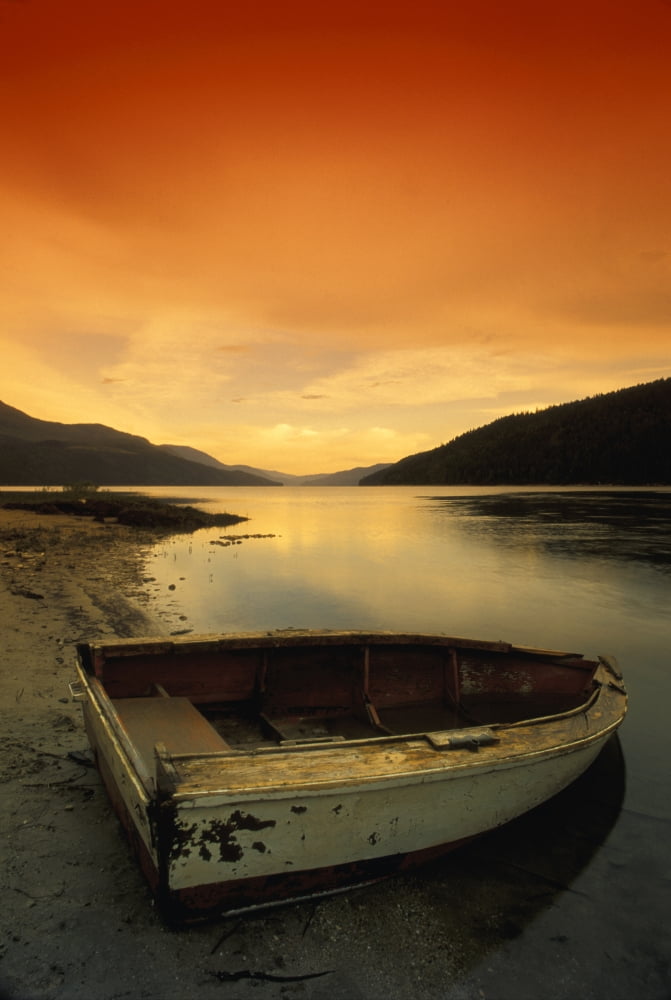Old Rowboat At Waters Edge With Sunset Background Canvas Art - Don Hammond Design Pics (22 x 34)