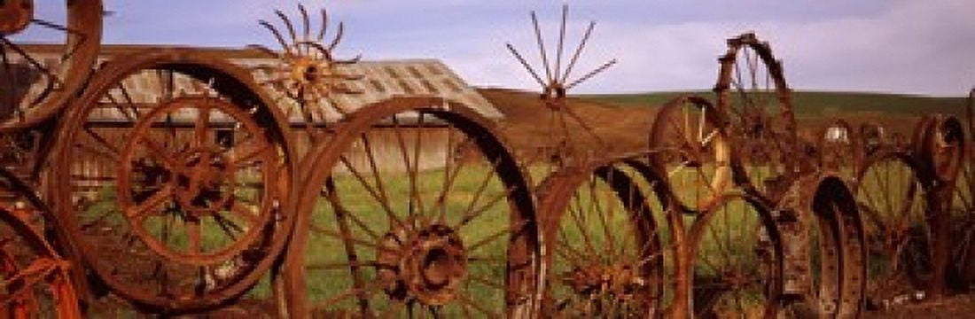 Old barn with a fence made of wheels Palouse Whitman County Washington State USA Canvas Art - Panoramic Images (18 x 6)