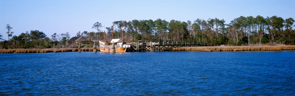 Old boat at coast Roanoke Marshes Lighthouse Outer Banks North Carolina USA Canvas Art - Panoramic Images (27 x 9)