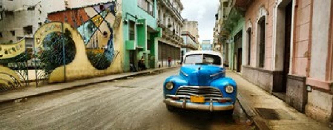 Old car and a mural on a street Havana Cuba Canvas Art - Panoramic Images (30 x 12)