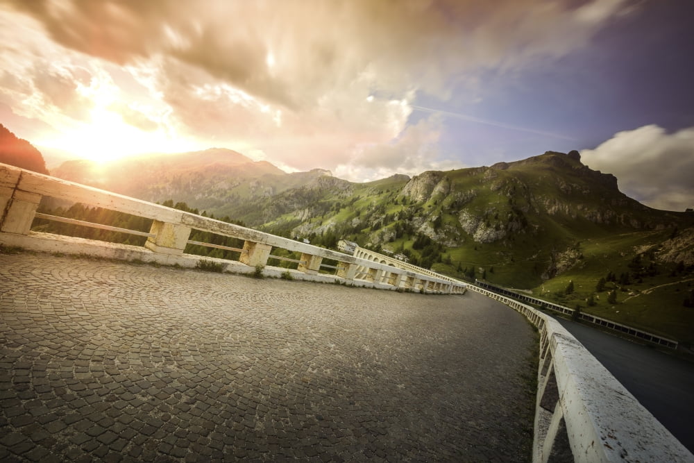 Old cobblestone road against moody sky at sunset Northern Italy Canvas Art - Evgeny KuklevStocktrek Images (18 x 12)