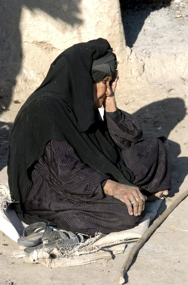 Old lady in stress during a millitary operation north of Basra Iraq Canvas Art - Andrew ChittockStocktrek Images (12 x 17)