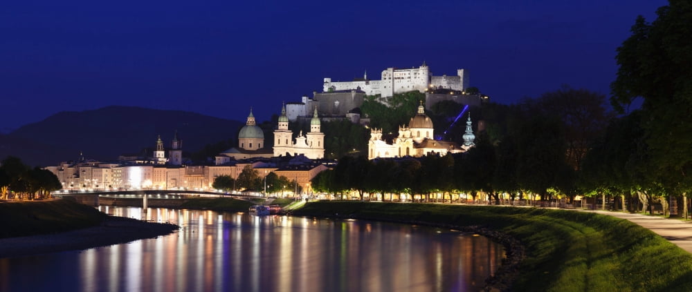 Old town with Hohensalzburg Castle and Dom Cathedral at the river Salzach at dusk Salzburg Salzburger Land Austria Canvas Art - Panoramic Images (9 x 27)