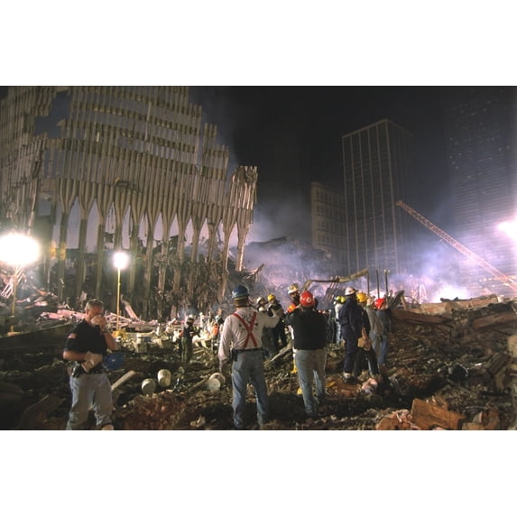 On The South West Area Of Ground Zero A Bucket Line Removes Debris At Night History (36 x 24)