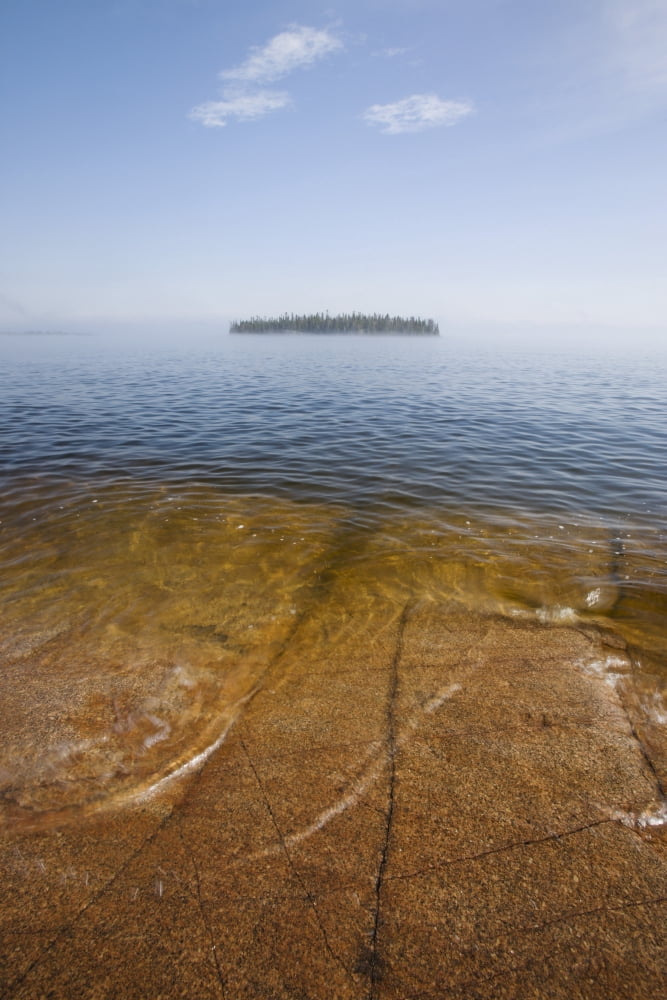 Ontario Canada An Island And A Large Rock Slab Under The Waters Surface On Lake Superior Canvas Art - Susan Dykstra Design Pics (12 x 19)